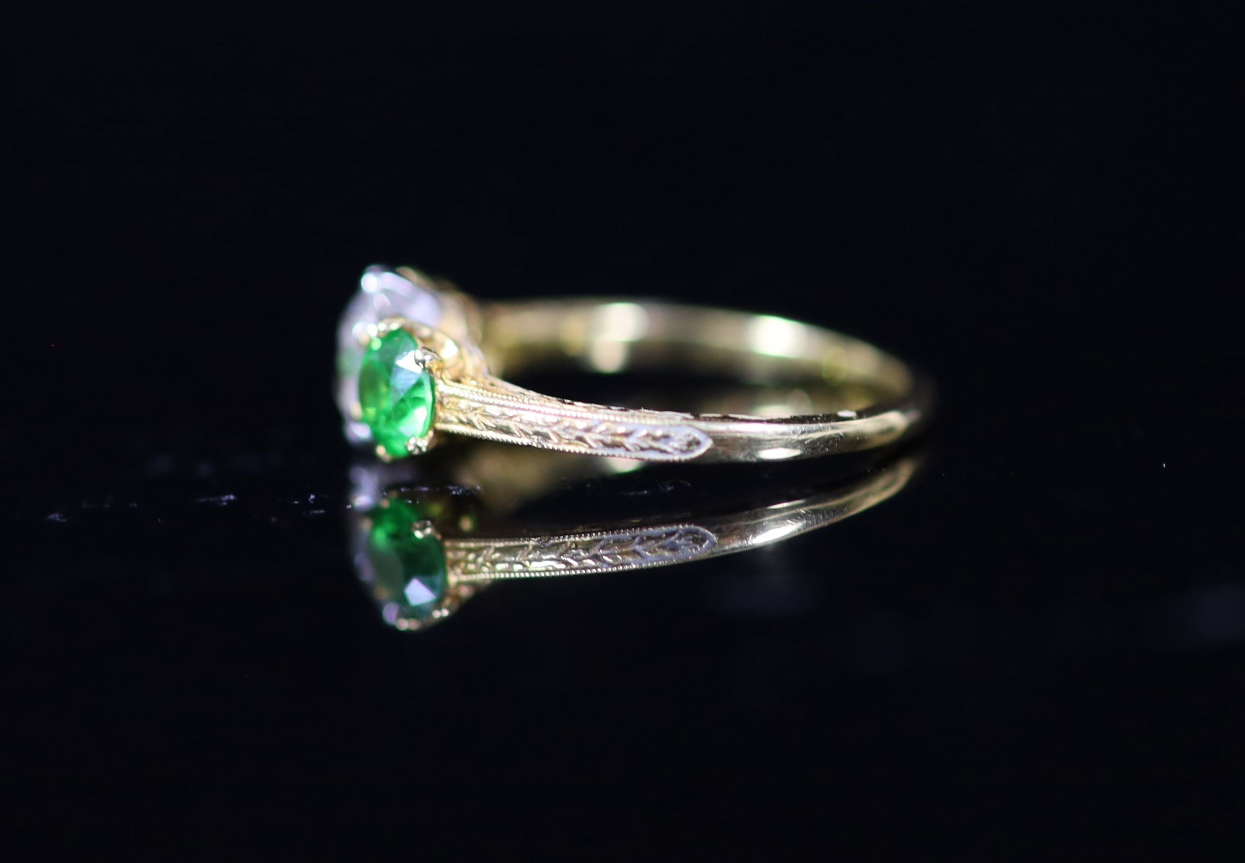 A Tiffany & Co gold, single stone diamond and two stone demantoid garnet set ring